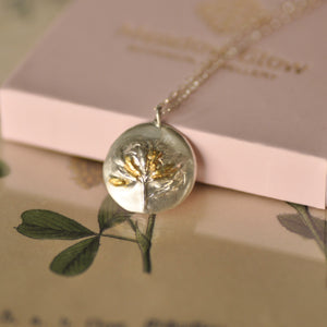 fine silver necklace with golden accents