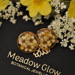 white and yellow blossom ear posts