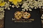 white and yellow blossom ear posts