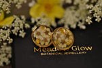 white and yellow blossom ear posts